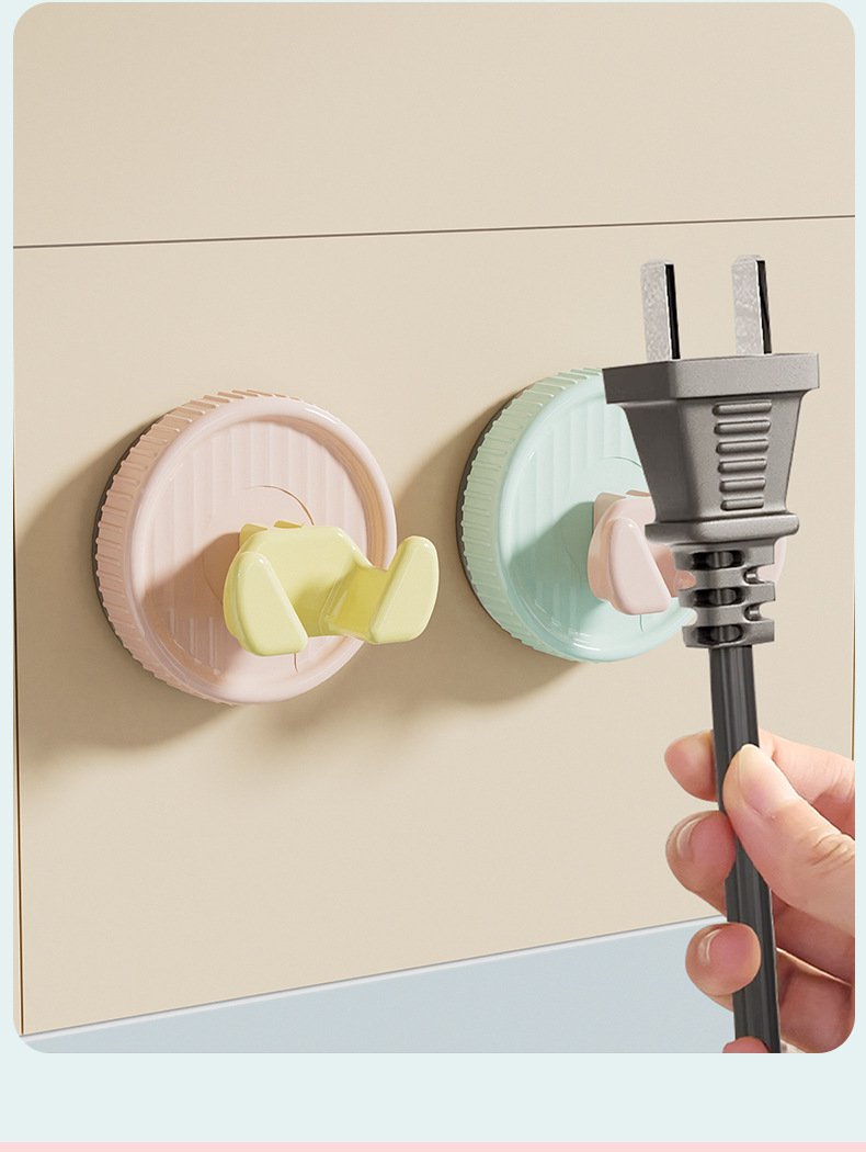 플러그와 전선을 동시에 정리하는 흡착판걸이