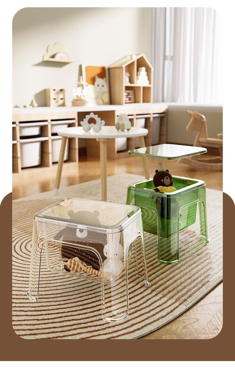 Transparent storage ottoman with lid open showing storage space