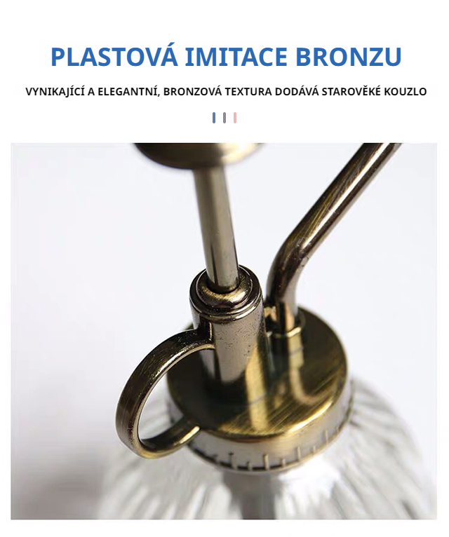 Decorative glass plant watering can on table