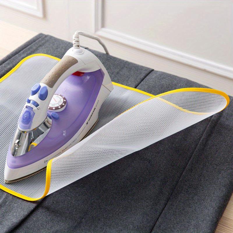 Ironing cloth guard protector in use on fabric