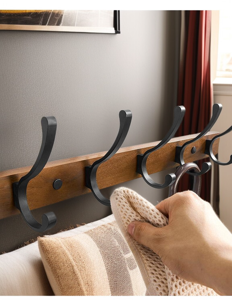 Black walnut hook holding coats and bags