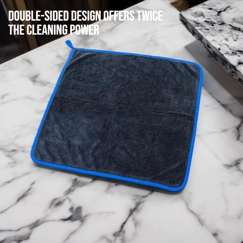 Double sided absorbent edge wrapped cleaning towel