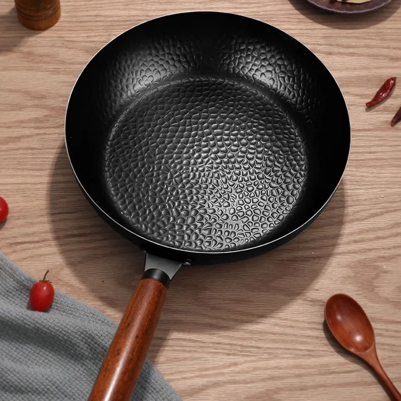Hammer patterned flat bottomed non stick pan