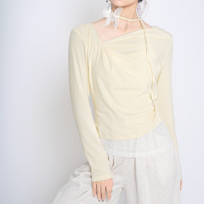 フェイクツーピース風の不規則な長袖トップス