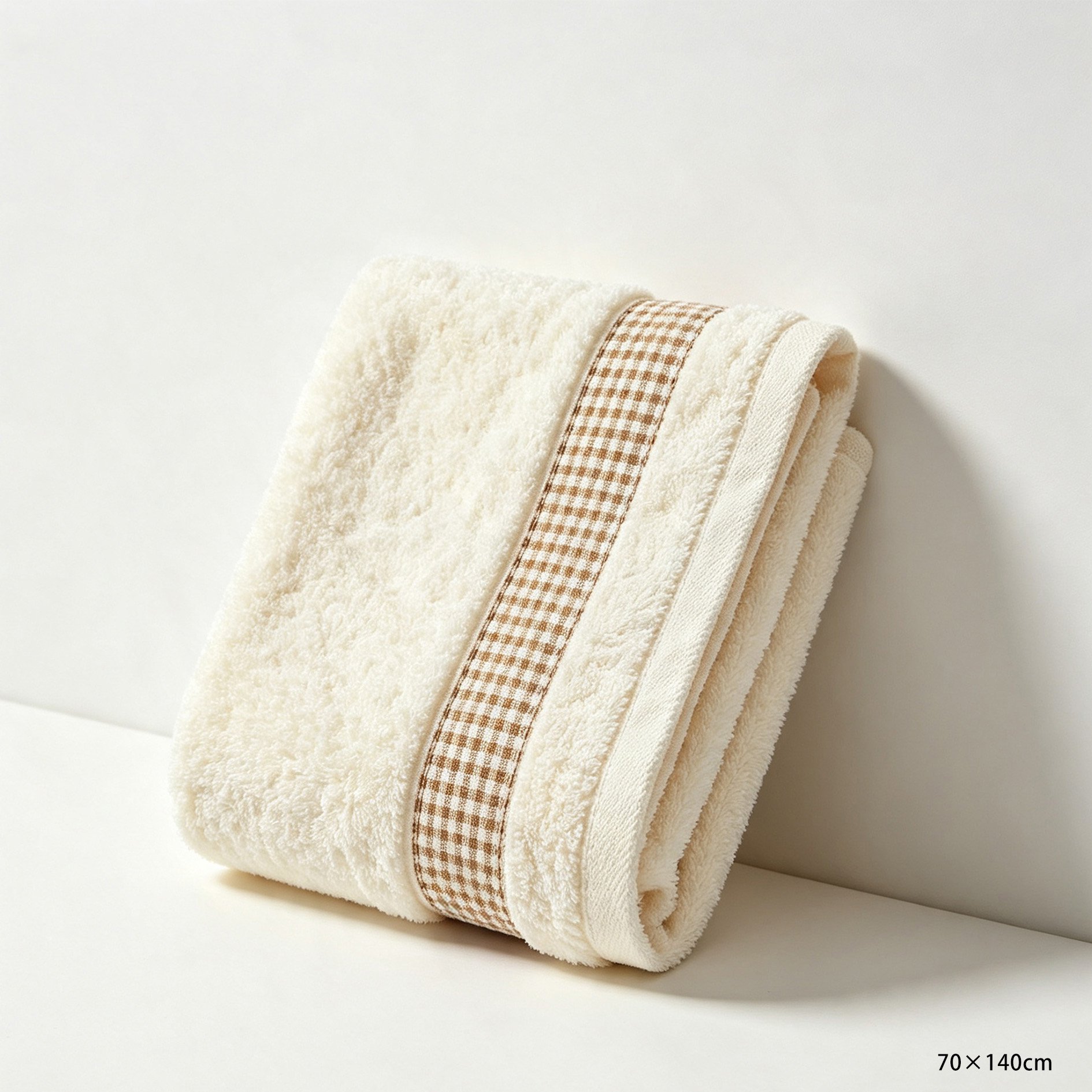 Luxurious and lightweight bath towel displayed on bed