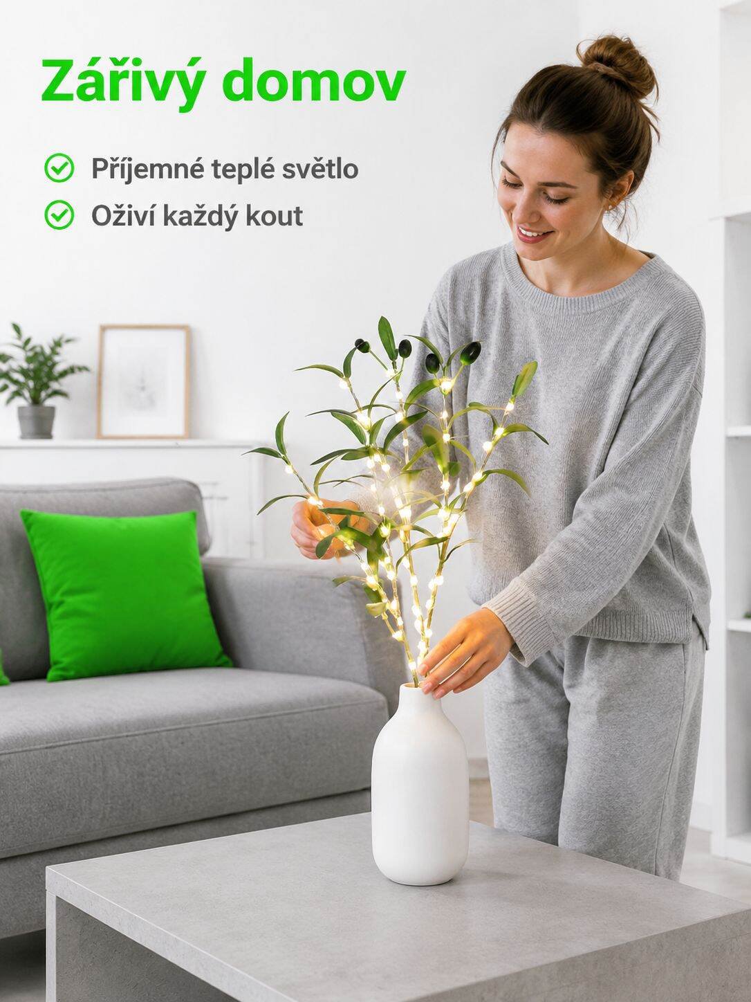 Dekorativní zelená oliva větev se světly v moderním interiéru