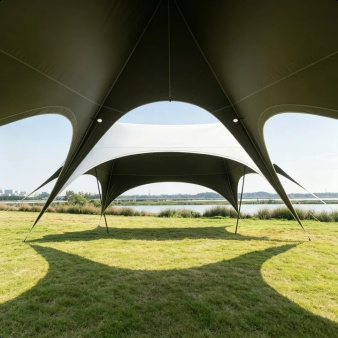 Rainproof sunshade canopy providing shelter during a rainy camping day