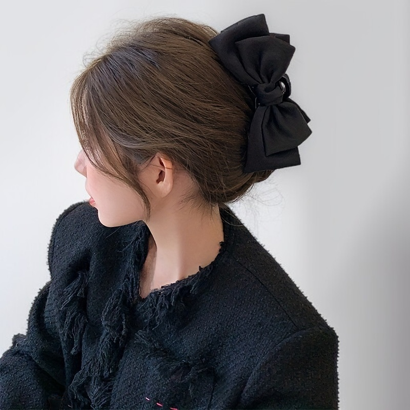 Arc-shaped claw clip