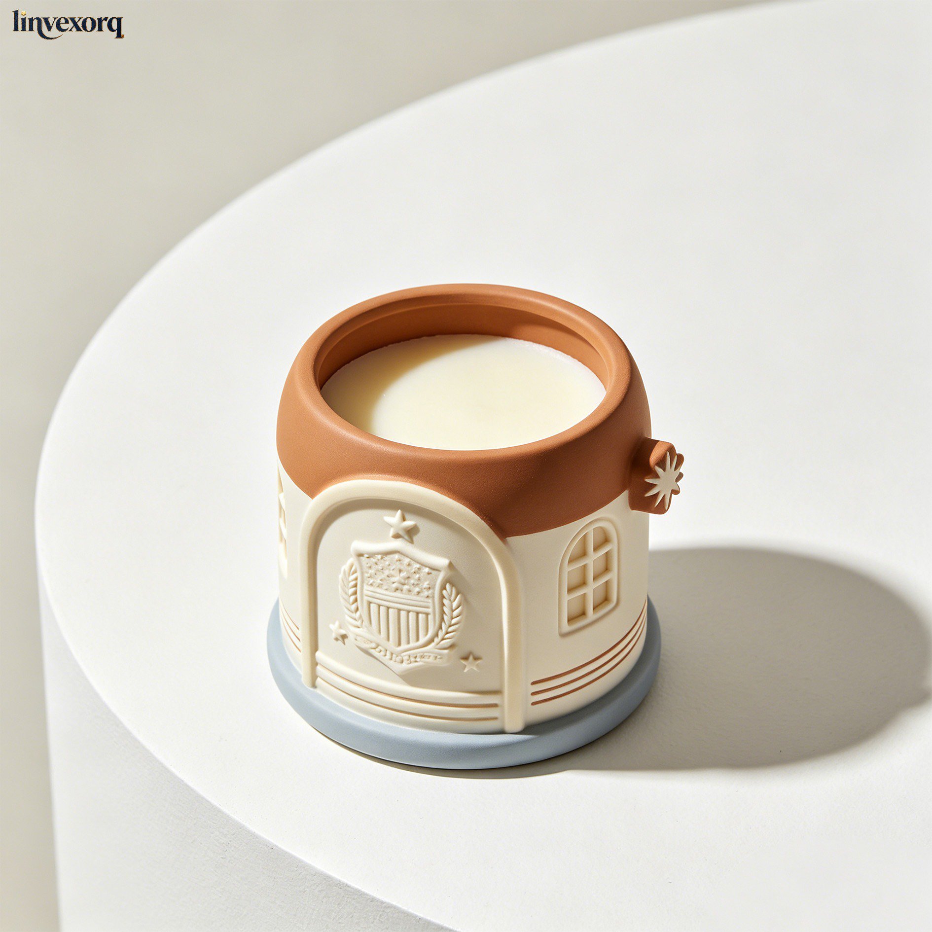 Soy wax scented candle burning in glass jar
