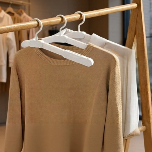 Travel-friendly folding hanger with sturdy clips
