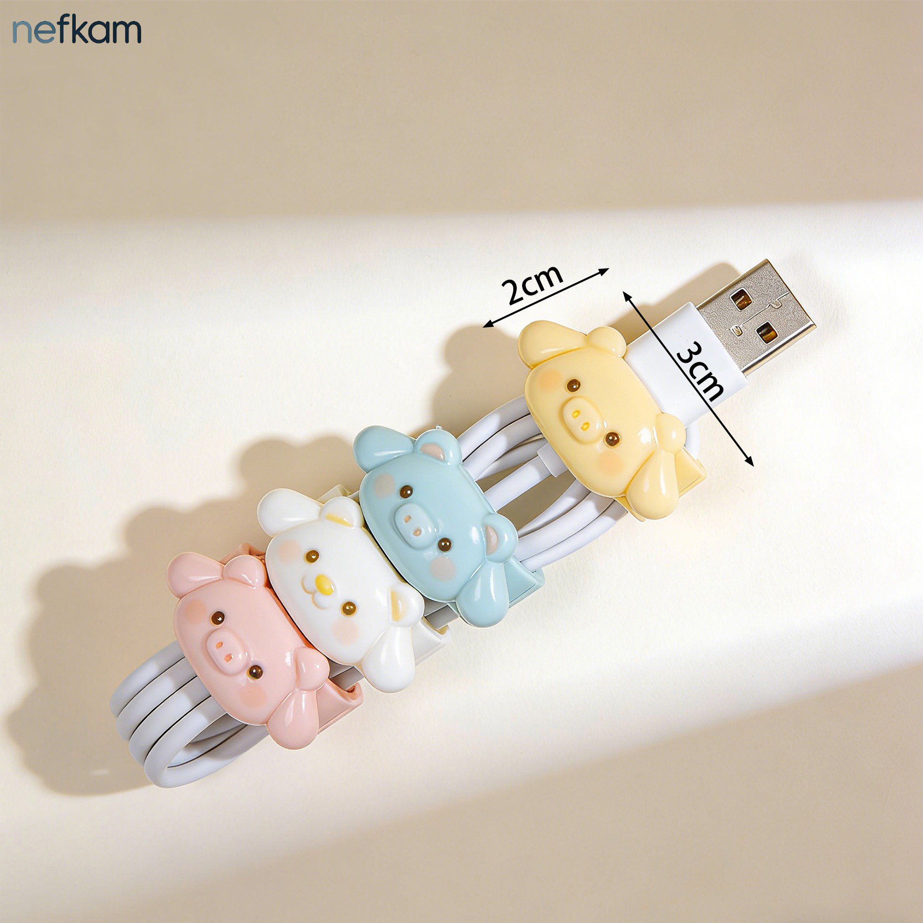 Four different cartoon cable holders displayed together