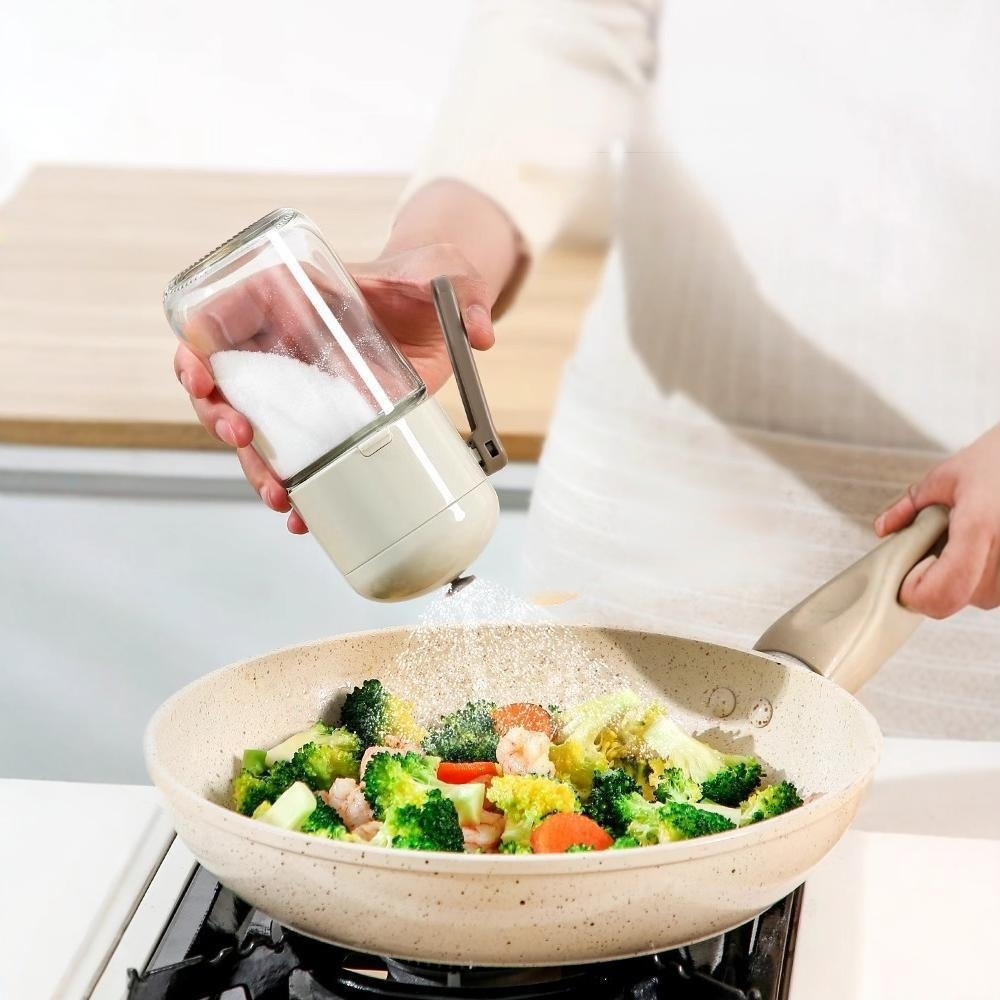 Multi functional kitchen with precise quantitative and even salt spraying tank