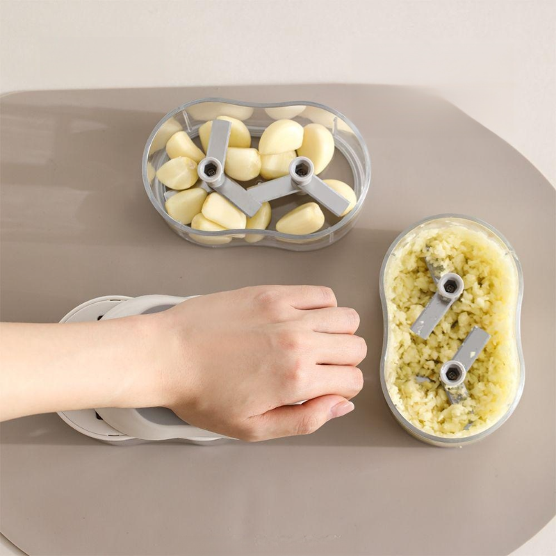 Multi-functional manual garlic mincer