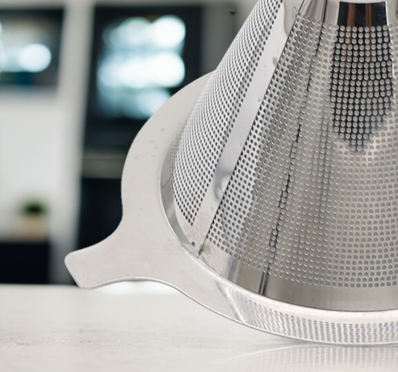 Barista placing coffee filter in coffee maker