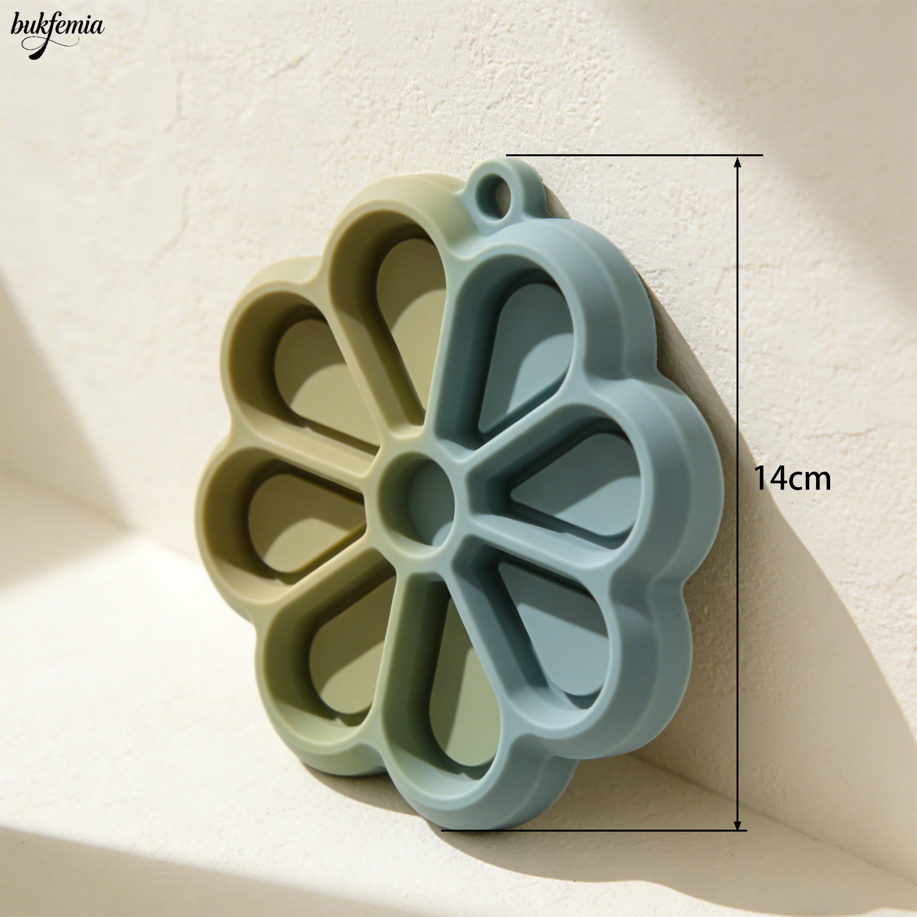 Flower-shaped silicone mats used as coasters on a dining table