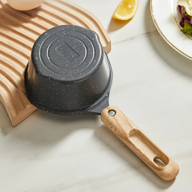 Pouring milk from multifunctional baby pan