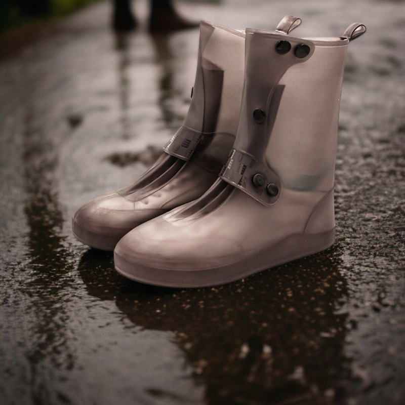Shoe covers protecting sneakers from water and mud