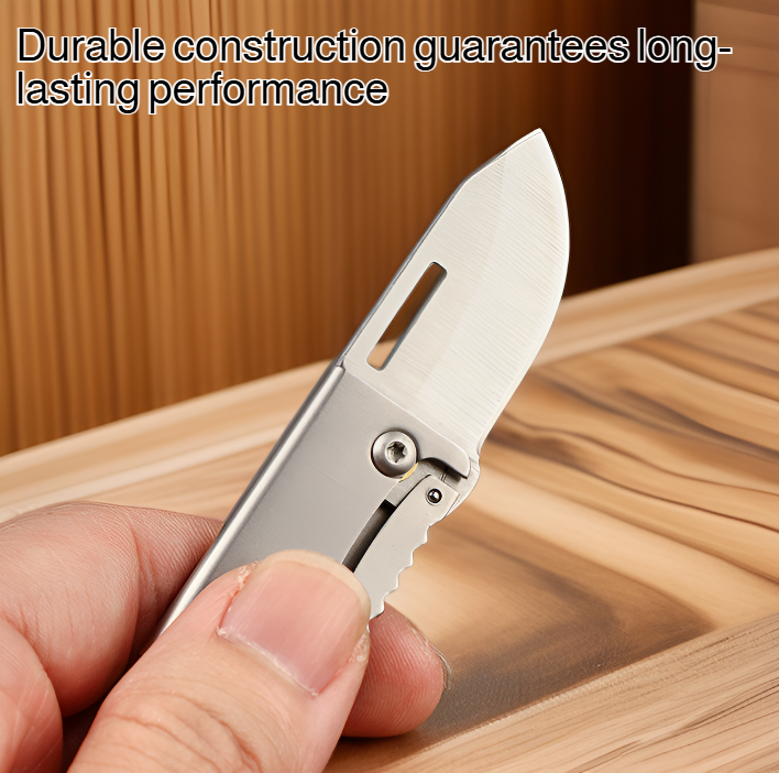 Portable folding knife in hand for scale