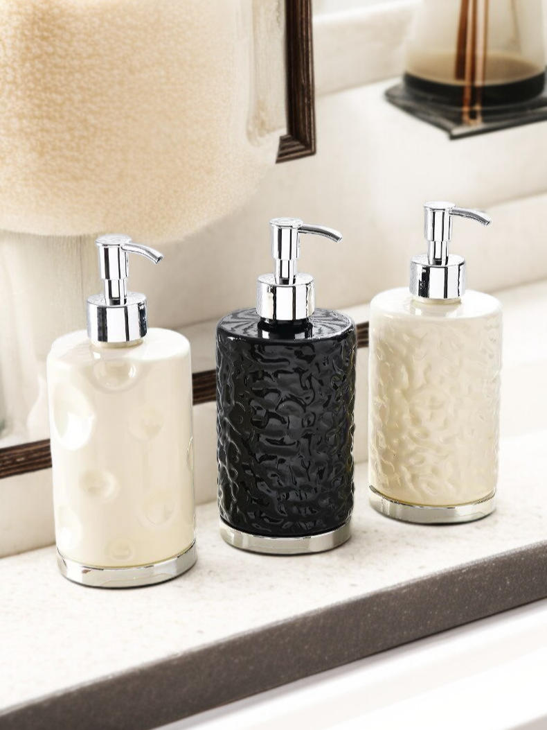 Set of sophisticated bathroom dispensers with pump tops
