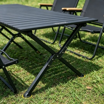Complete outdoor camping table and chair set displayed in nature
