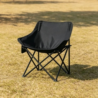 Moon chair in use at a seaside picnic
