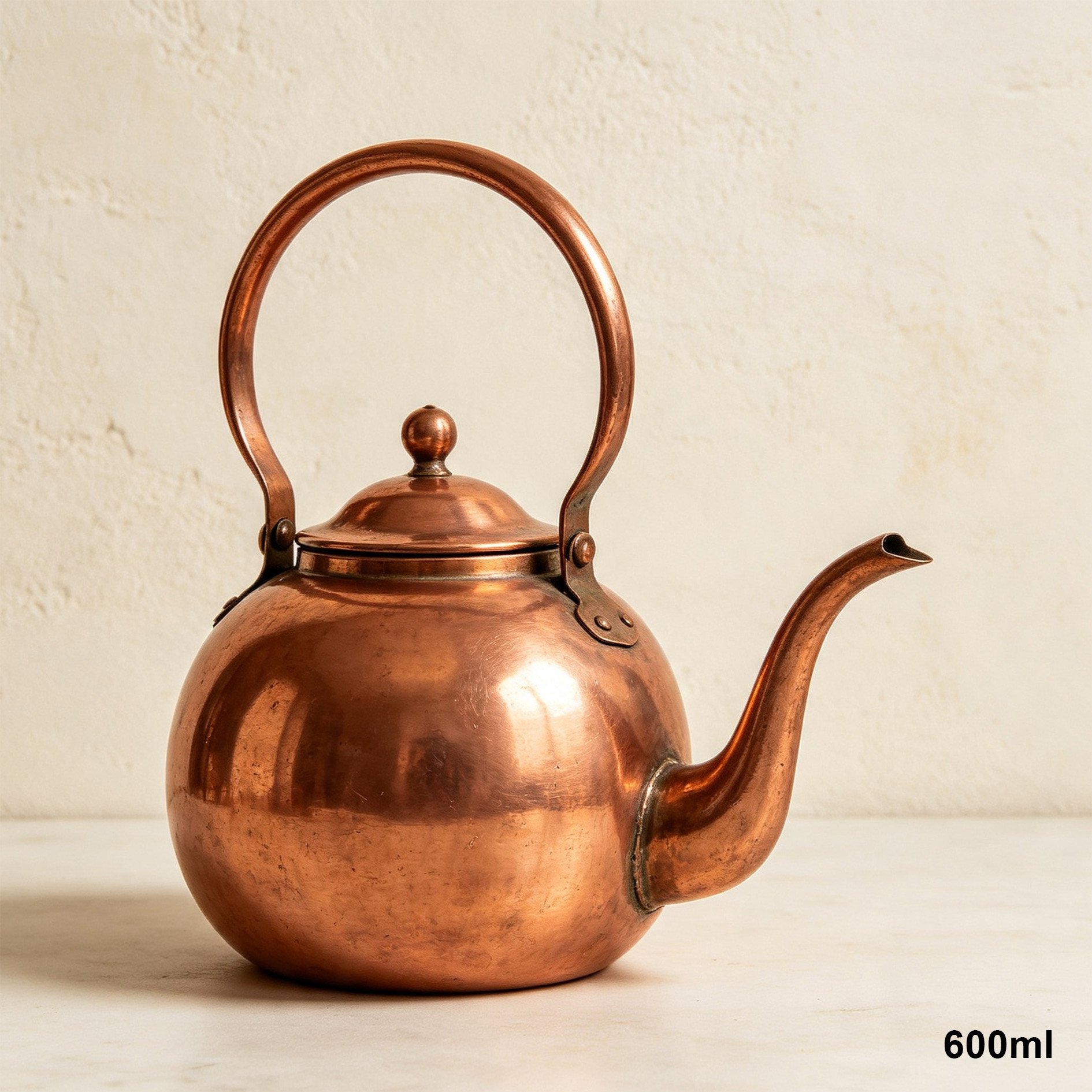 Elegant handmade copper teapot pouring tea