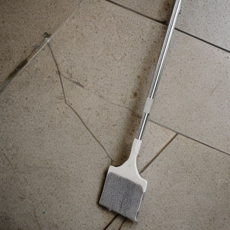 Telescopic double-sided window cleaning brush in use