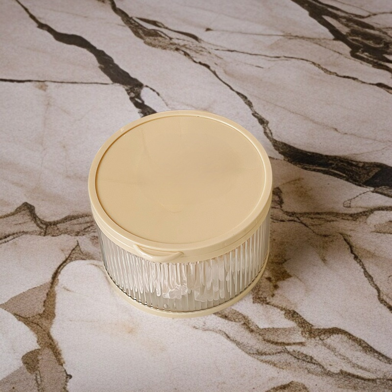 Open circular hair accessory box showing organized hair clips