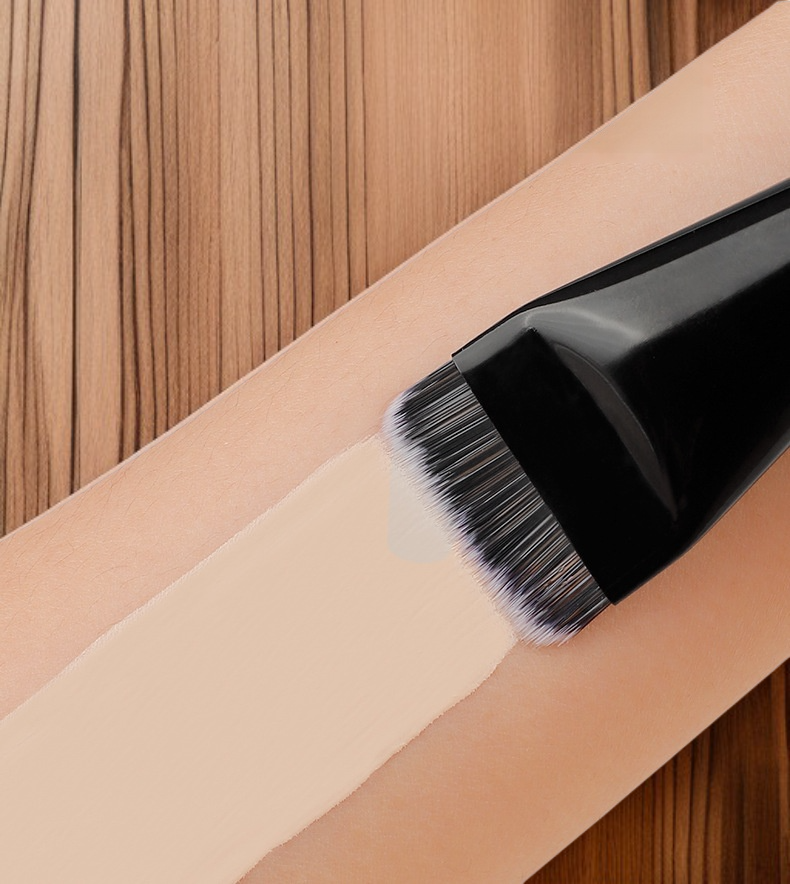 Close-up of dual head makeup brush with soft bristles