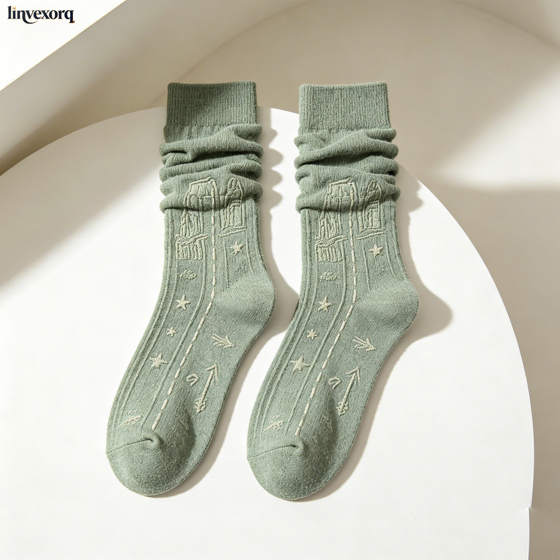 Set of five embroidered slouchy socks displayed on a white background