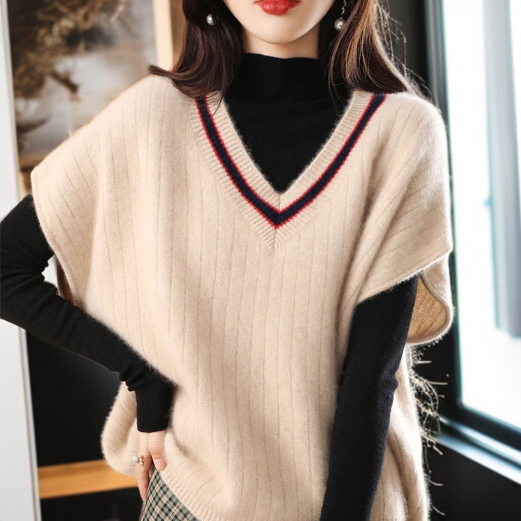 ニットの底の外にゆるいセーターの馬甲女性vネックの肩のセーターの外にゆるい馬甲がついている