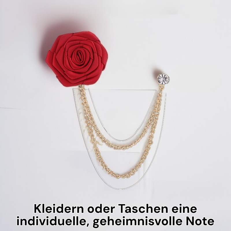 Brosche mit schwarzer Rose auf weißem Hintergrund