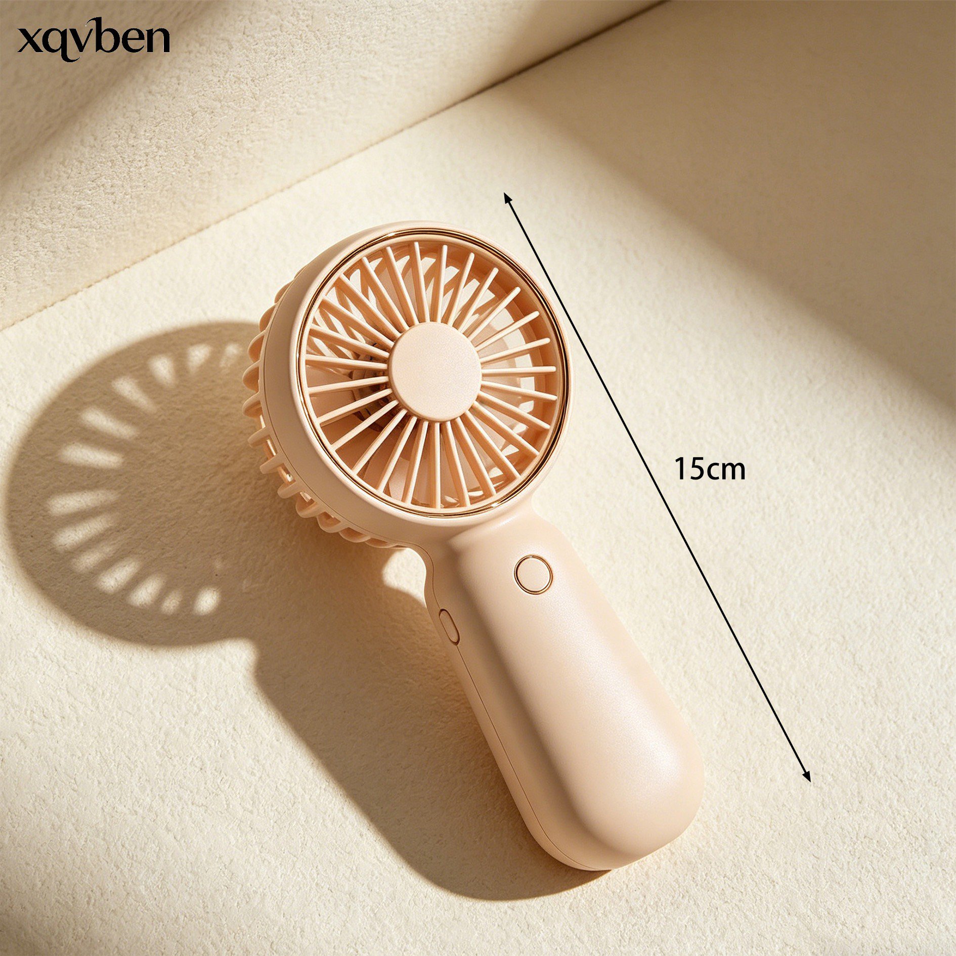 Portable mini fan in hand for size reference