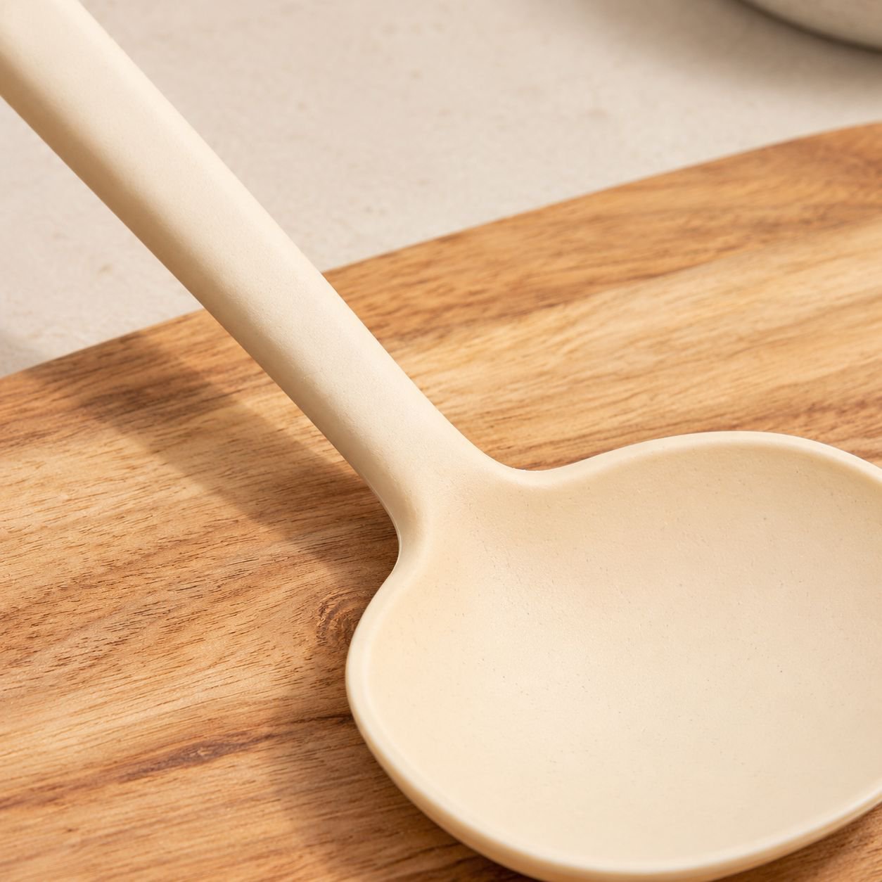 Non-stick pan scraper kitchen tool on countertop