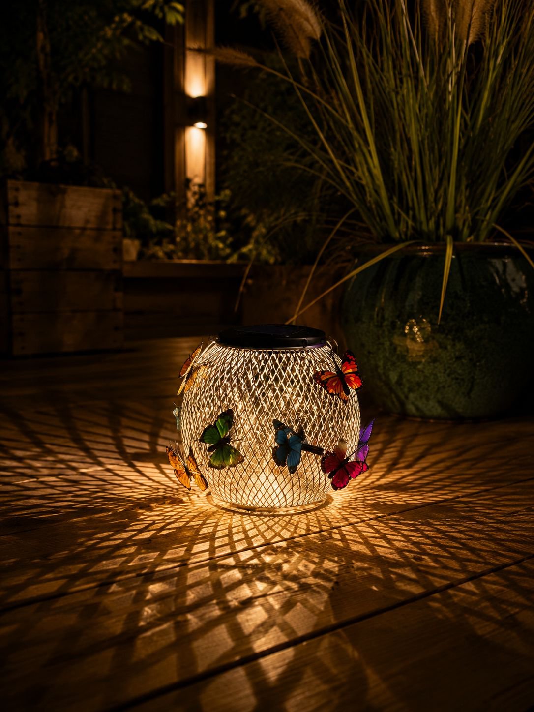 Weather-resistant solar butterfly lamp in a flowerbed