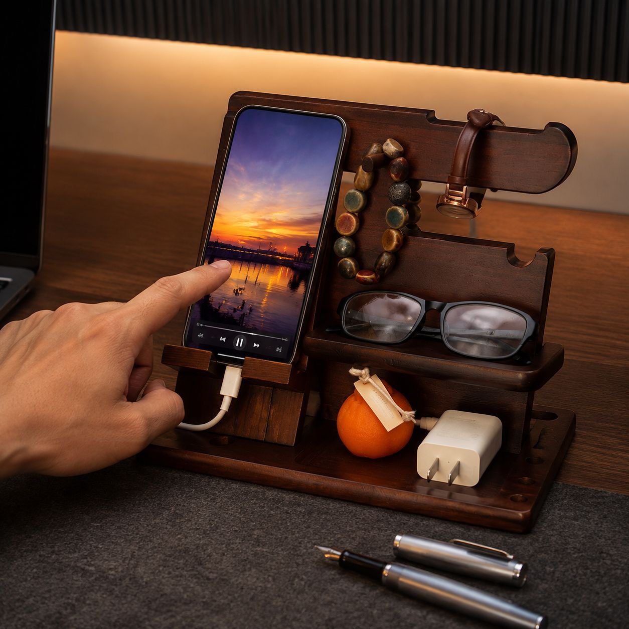 Close-up of wooden phone stand with key storage