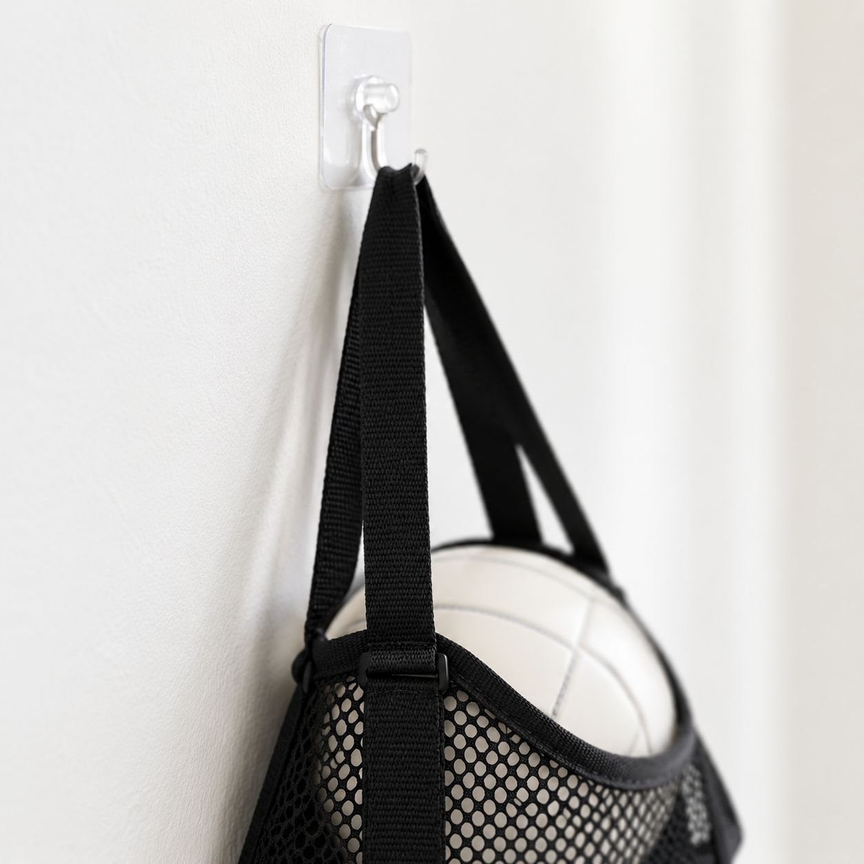 Basketball and soccer ball storage rack in garage