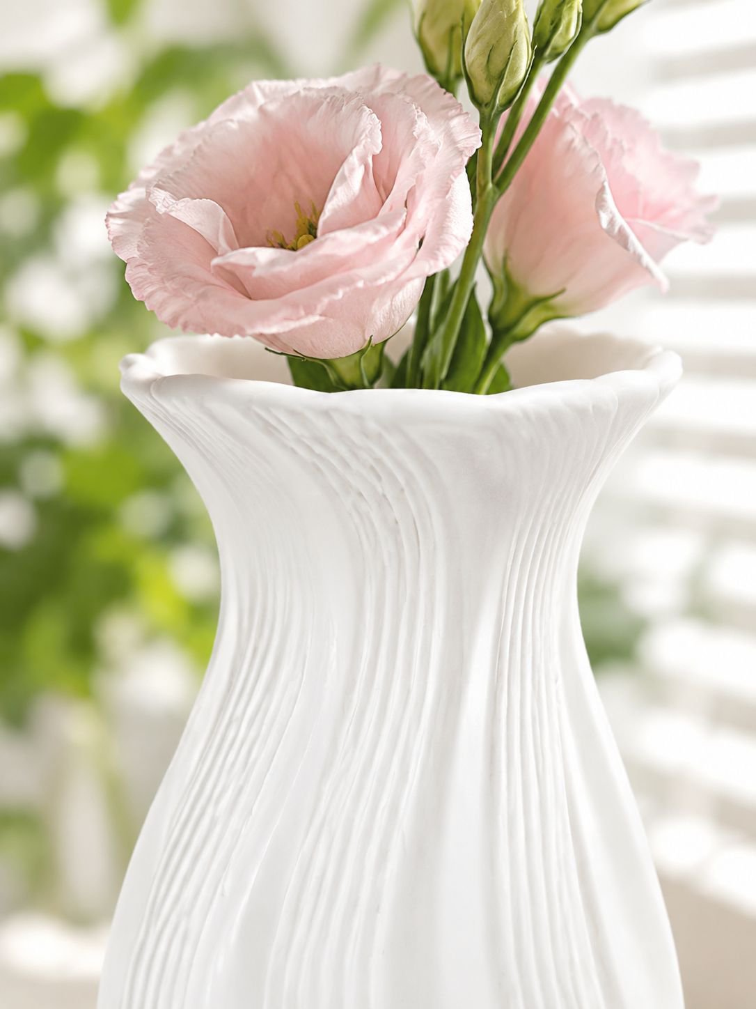 Decorative gradient vase holding a fresh bouquet of flowers