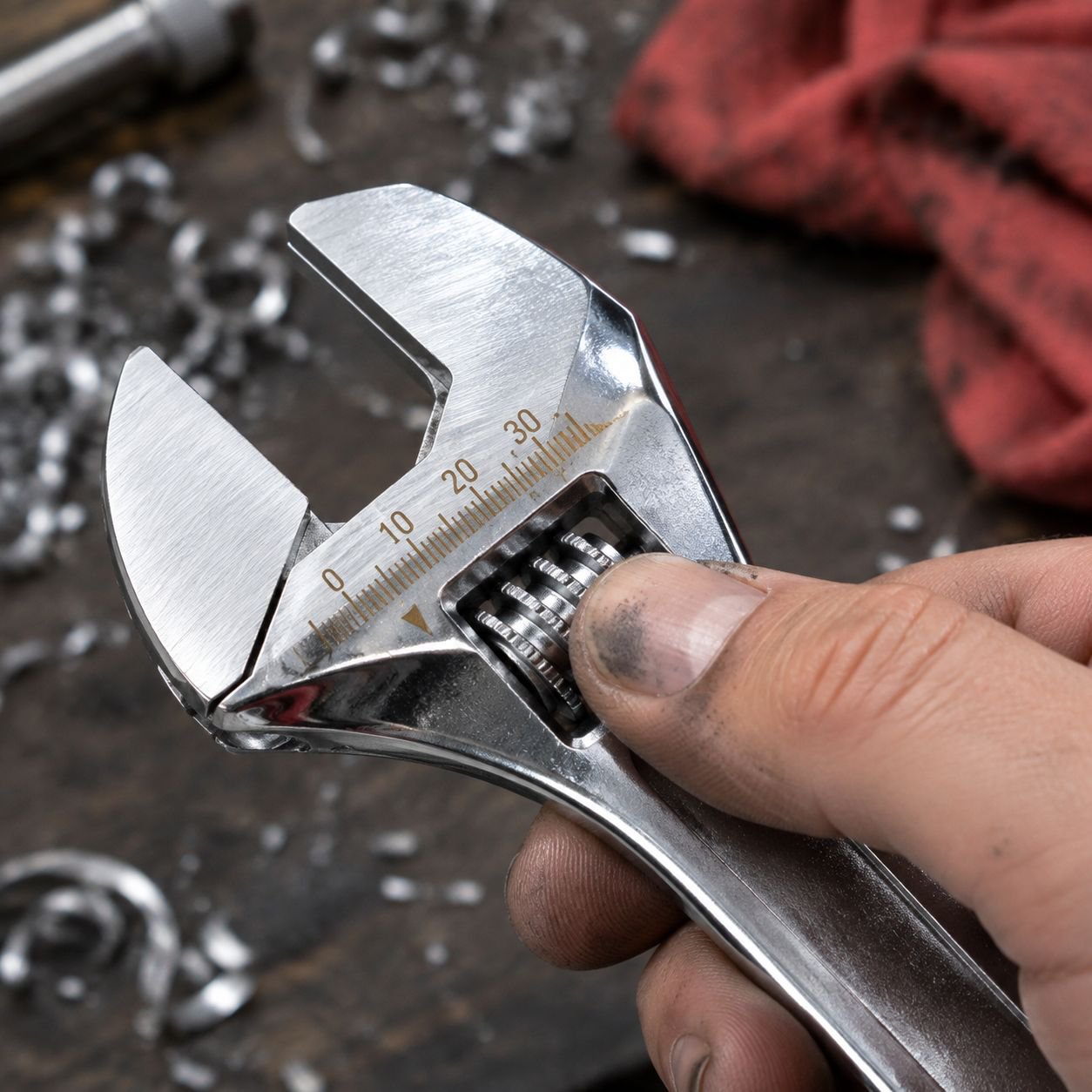 Close-up of carbon steel adjustable wrench with ergonomic handle