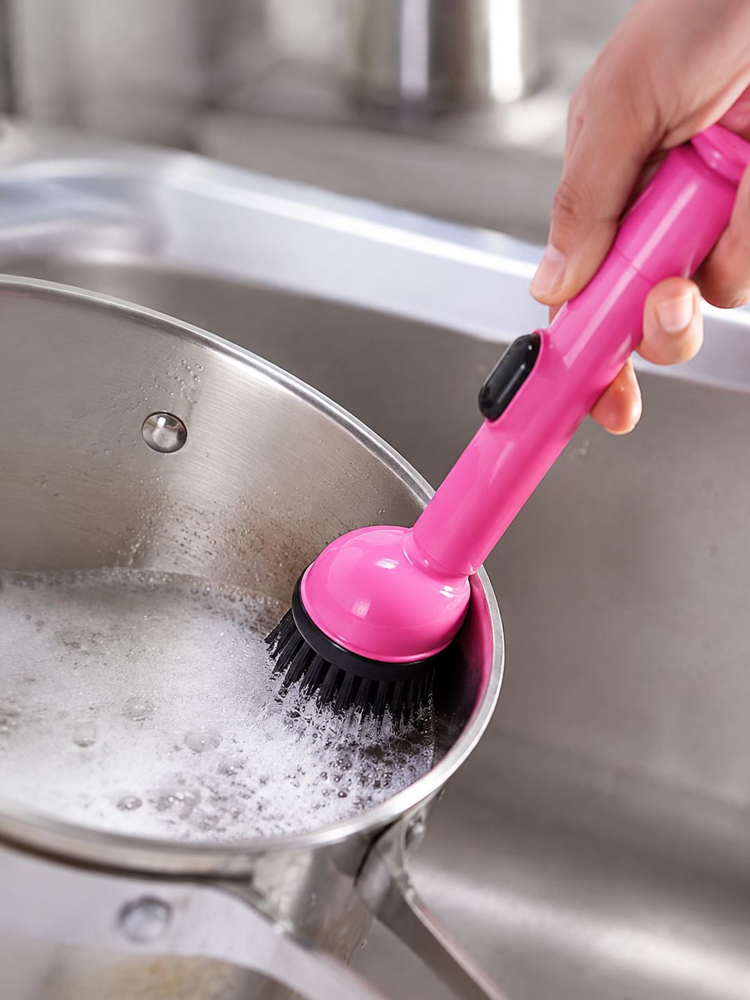 Refillable liquid dispenser feature of the cleaning brush