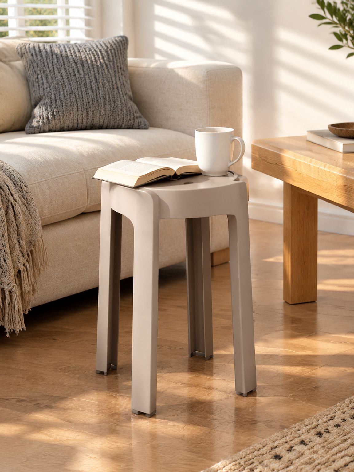 Minimalist home stool placed beside a sofa