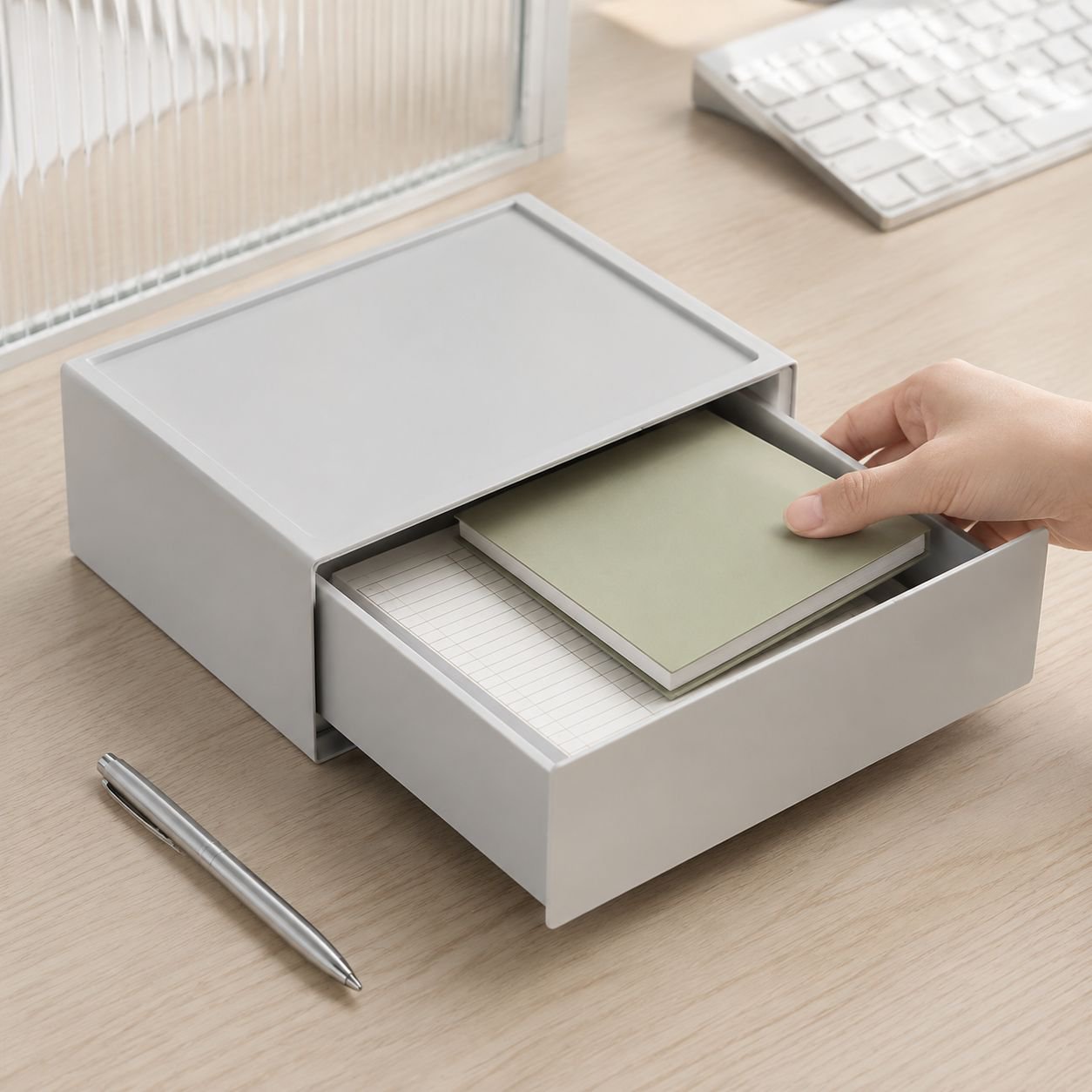 Office desk with organized supplies in plastic storage container