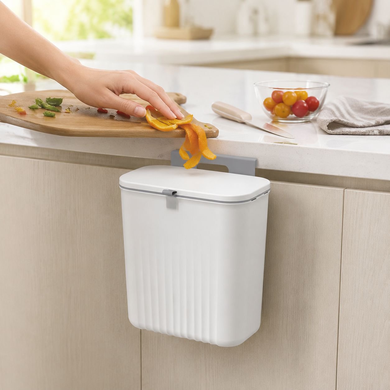Wall-mounted sliding lid waste bin installed in kitchen