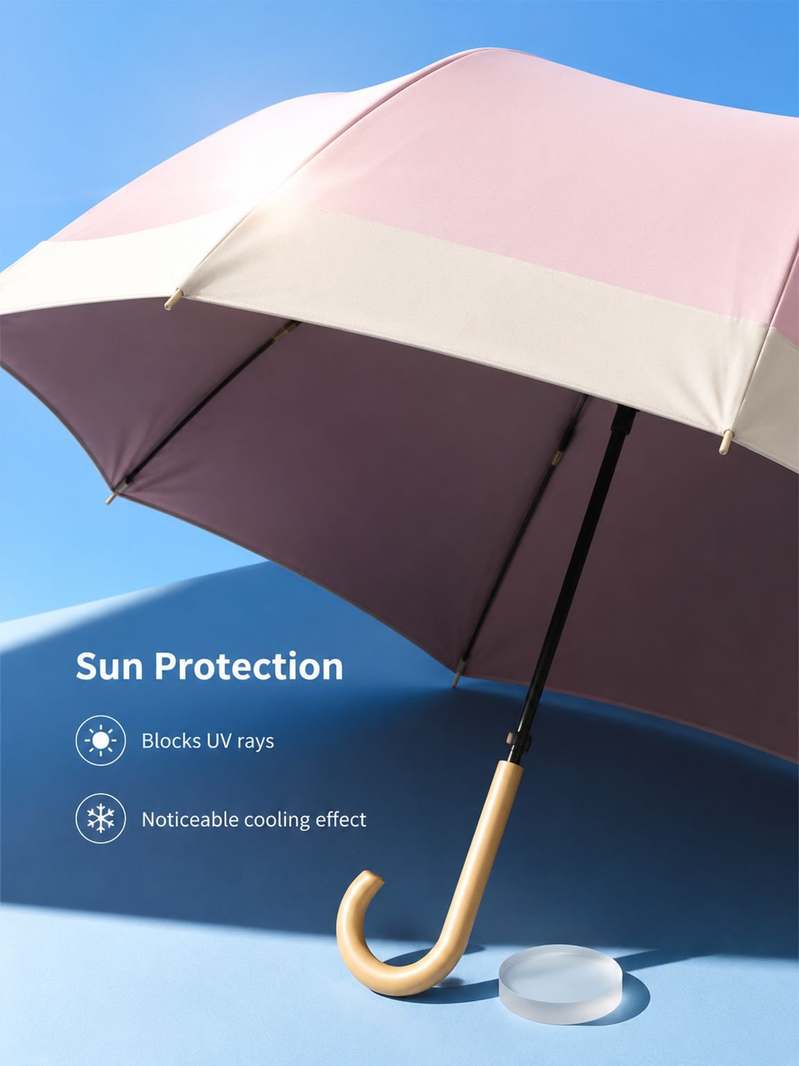 Curved hook handle detail on a long umbrella