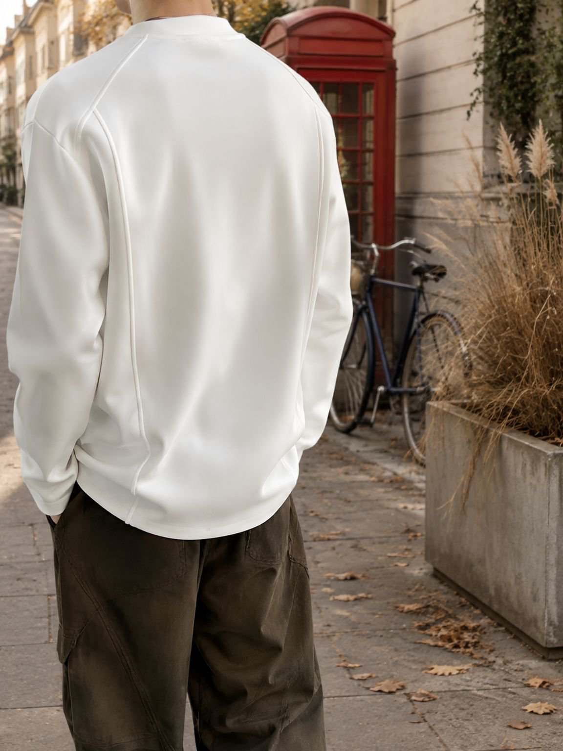 Men wearing white long-sleeve t-shirt layered under jacket