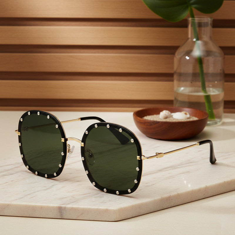 Lunettes de soleil rondes à monture métallique avec rivets