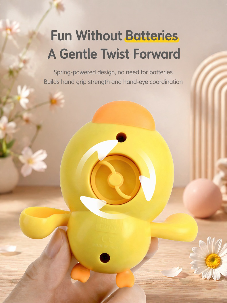 Toddler playing with diving duck bath toy