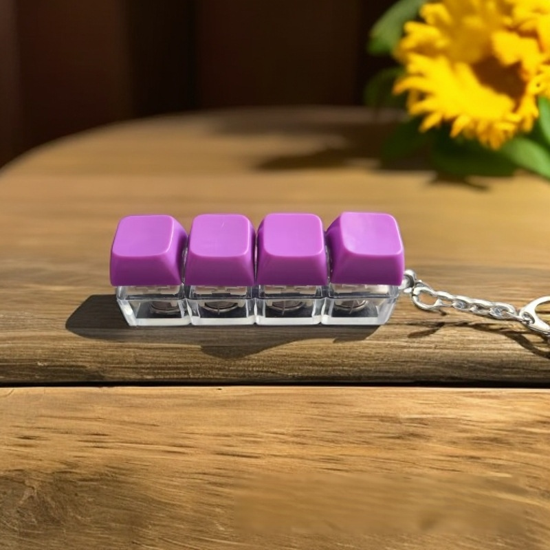 Porte-clés déstressant à boutons lumineux arc-en-ciel