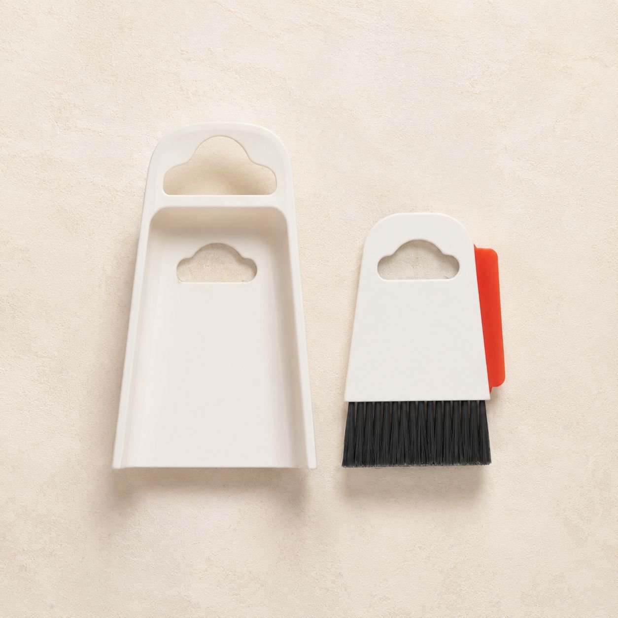 Efficient desk cleaning with mini broom and dustpan
