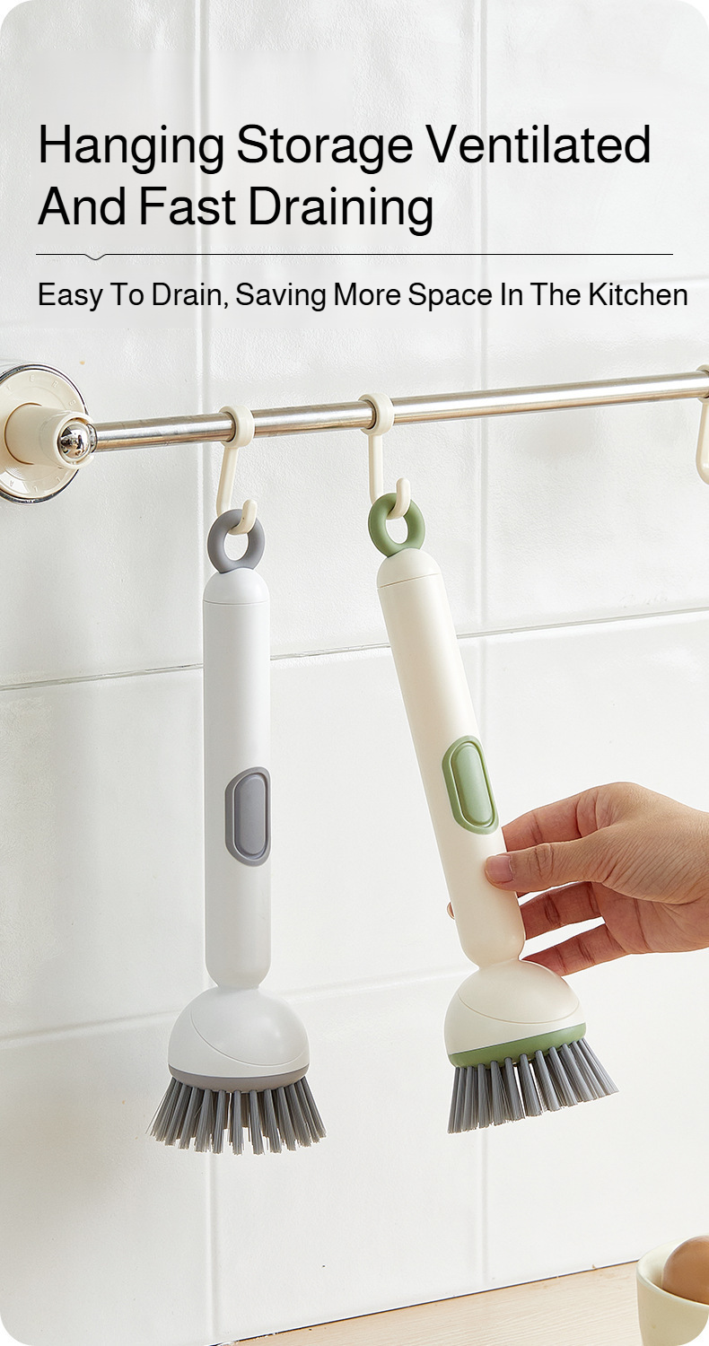 Long handle brush in use on non-stick pan